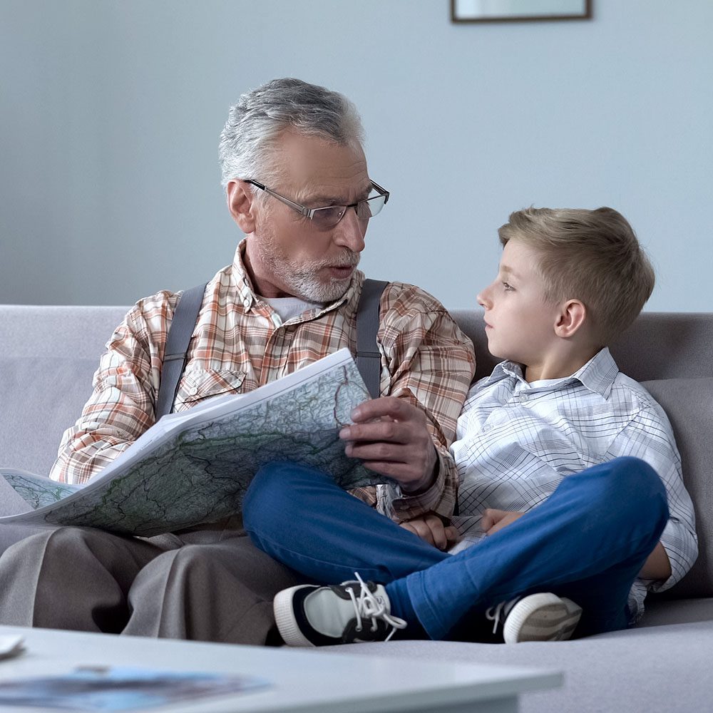 VA Claims Management - Case Study - Veteran discussing map with young boy
